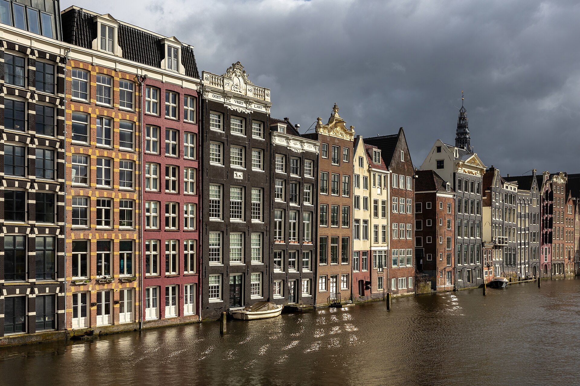 Canal houses at golden hour on Damrak in Amsterdam