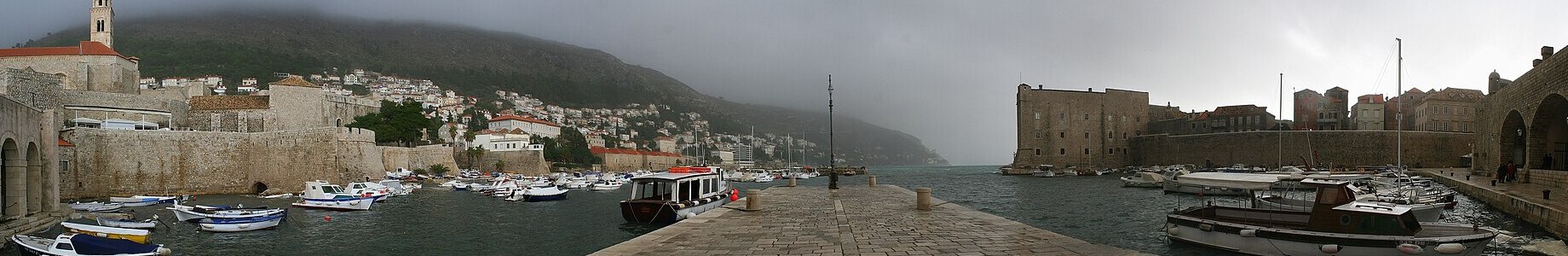 Panoramic view of Dubrovnik's old port and harbor walls