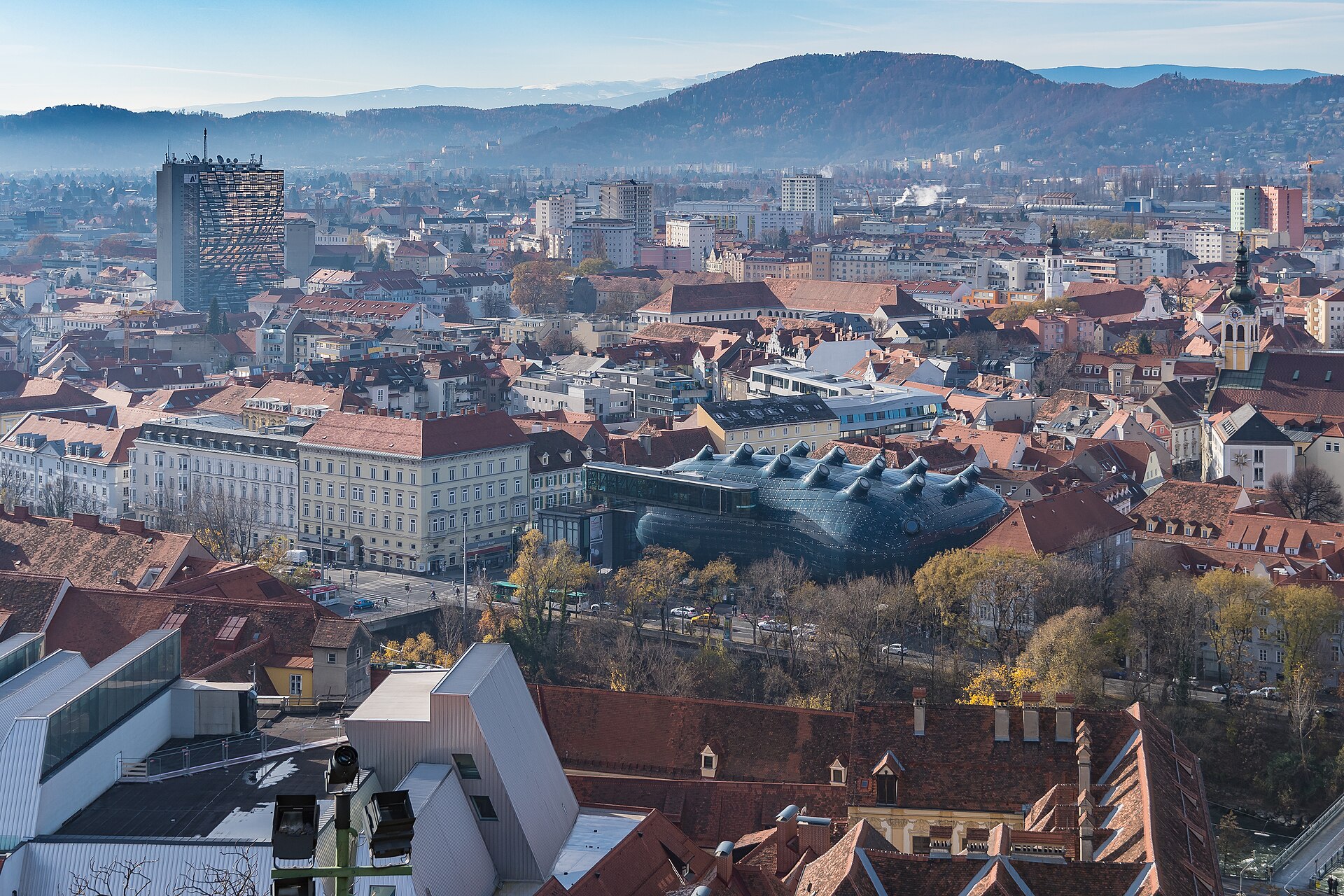 View across central Graz from the Schlossberg with the old town and green hills beyond