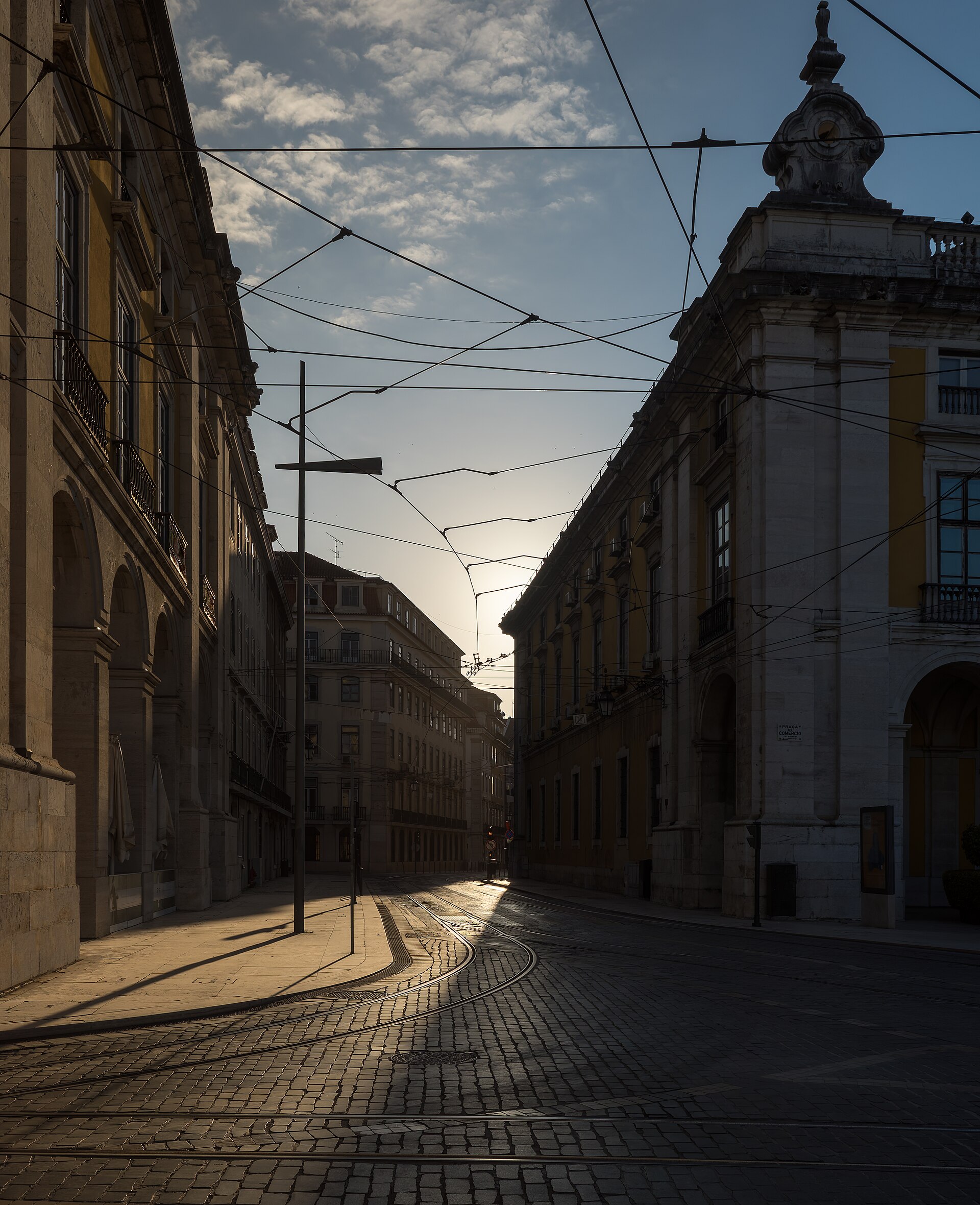 Early morning tram lines leading into Praça do Comércio in Lisbon