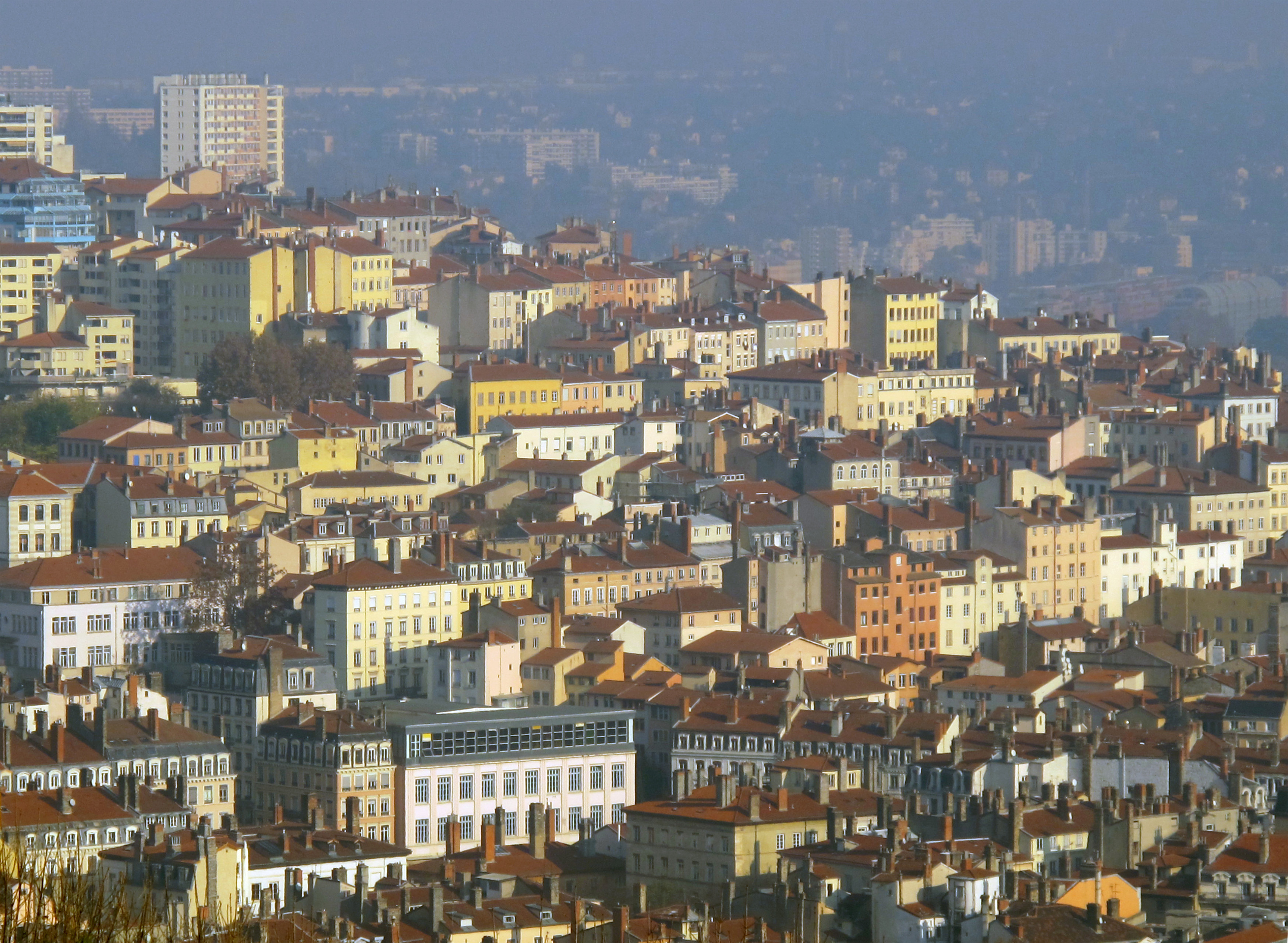 Lyon hillside buildings and rooftops in warm light