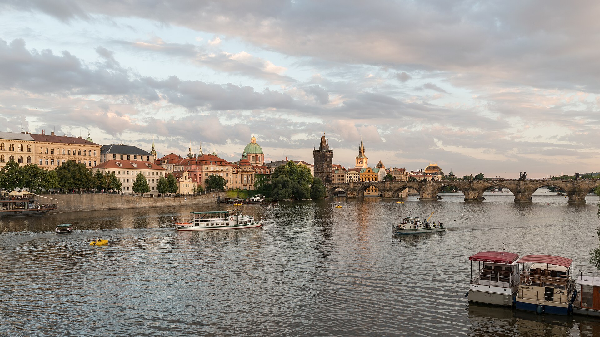 Charles Bridge across the Vltava in Prague at dusk