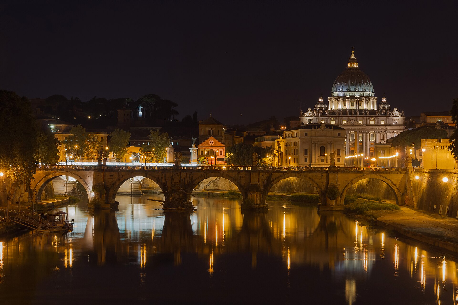 Saint Peter's Basilica seen from the Sant'Angelo bridge at night in Rome