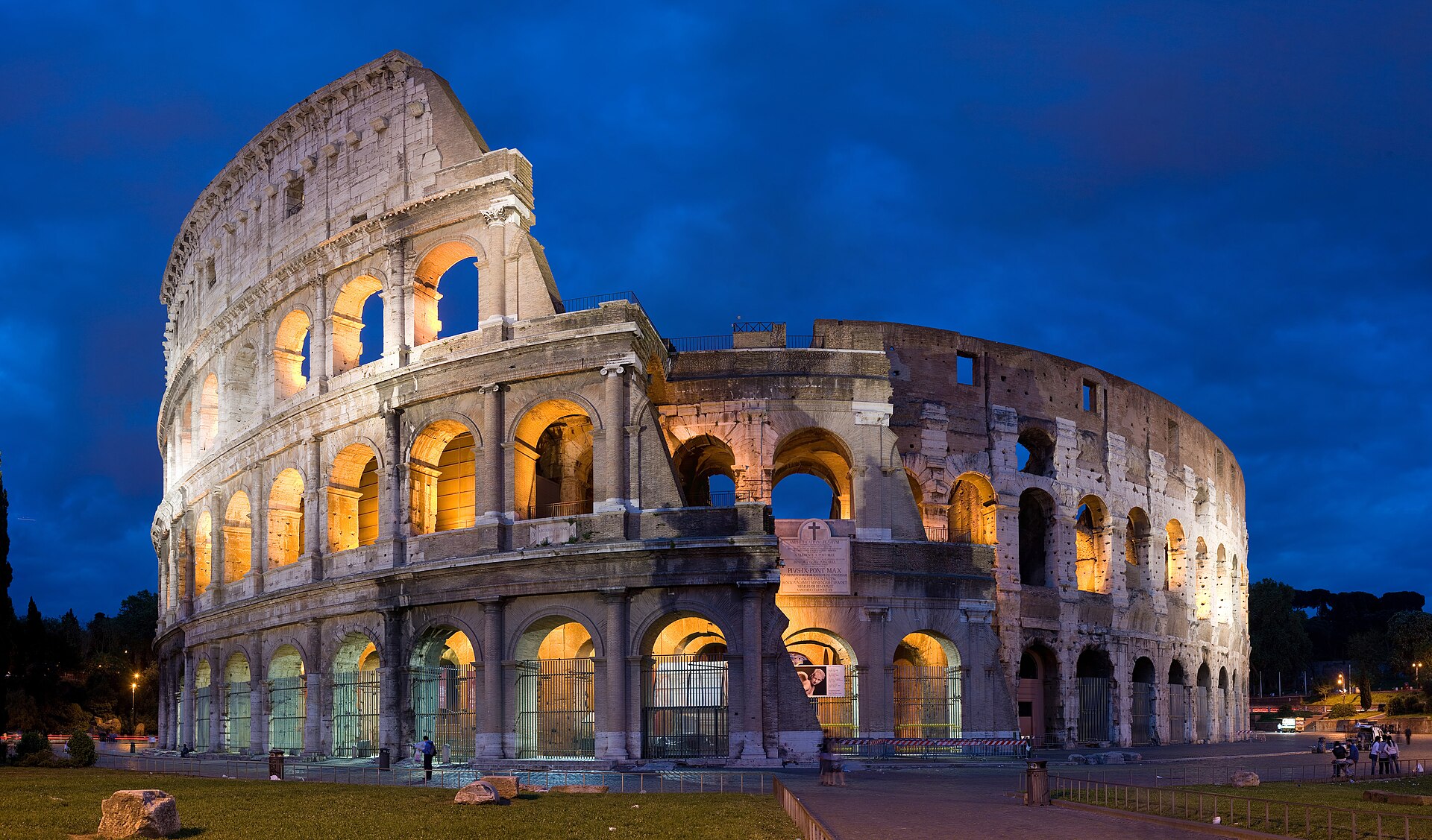 The Colosseum lit at blue hour in Rome