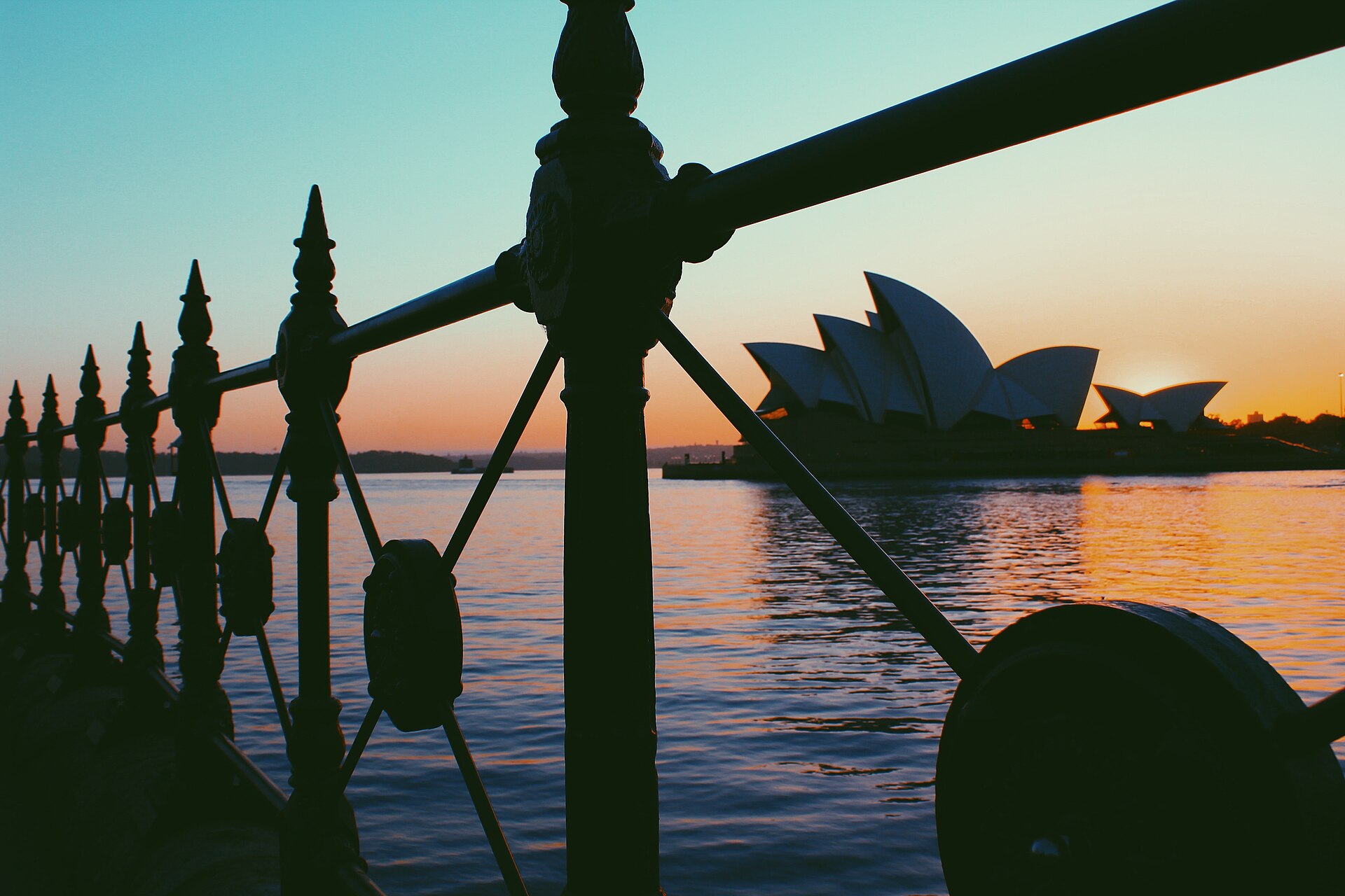 Sunrise view across Sydney Harbour toward the Opera House