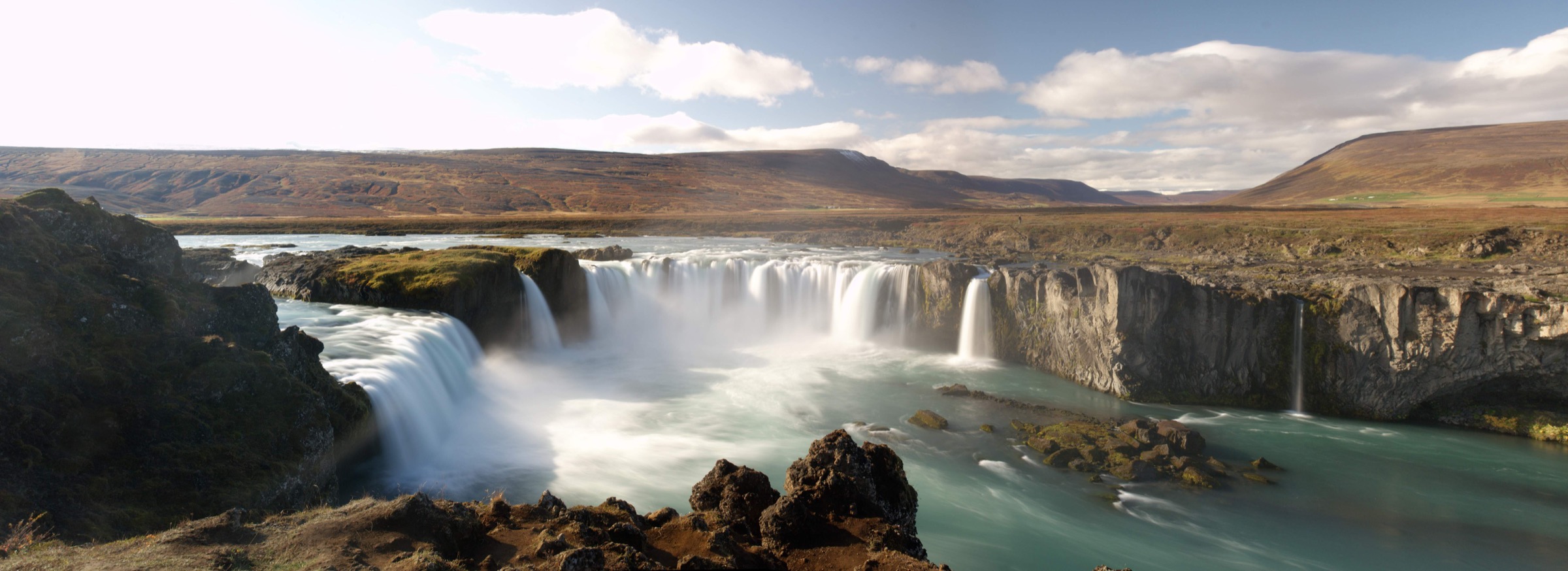 Godafoss waterfall in Iceland under bright northern light