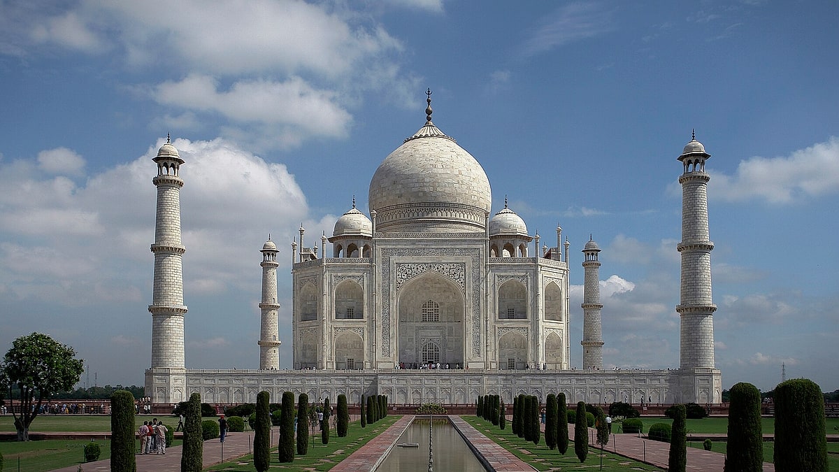 The Taj Mahal reflected in its formal garden pool in Agra, India