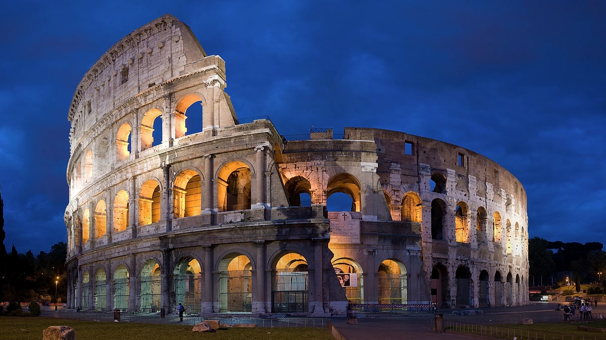 The Colosseum lit by warm light in Rome, Italy