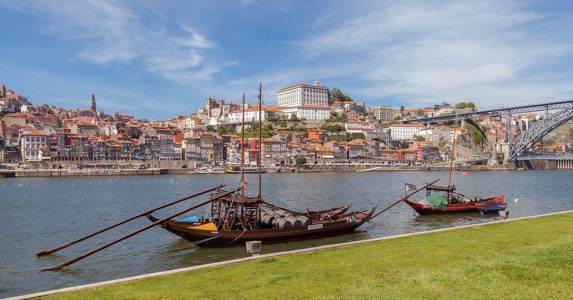 Traditional rabelo boats on the Douro with Porto behind them in Portugal
