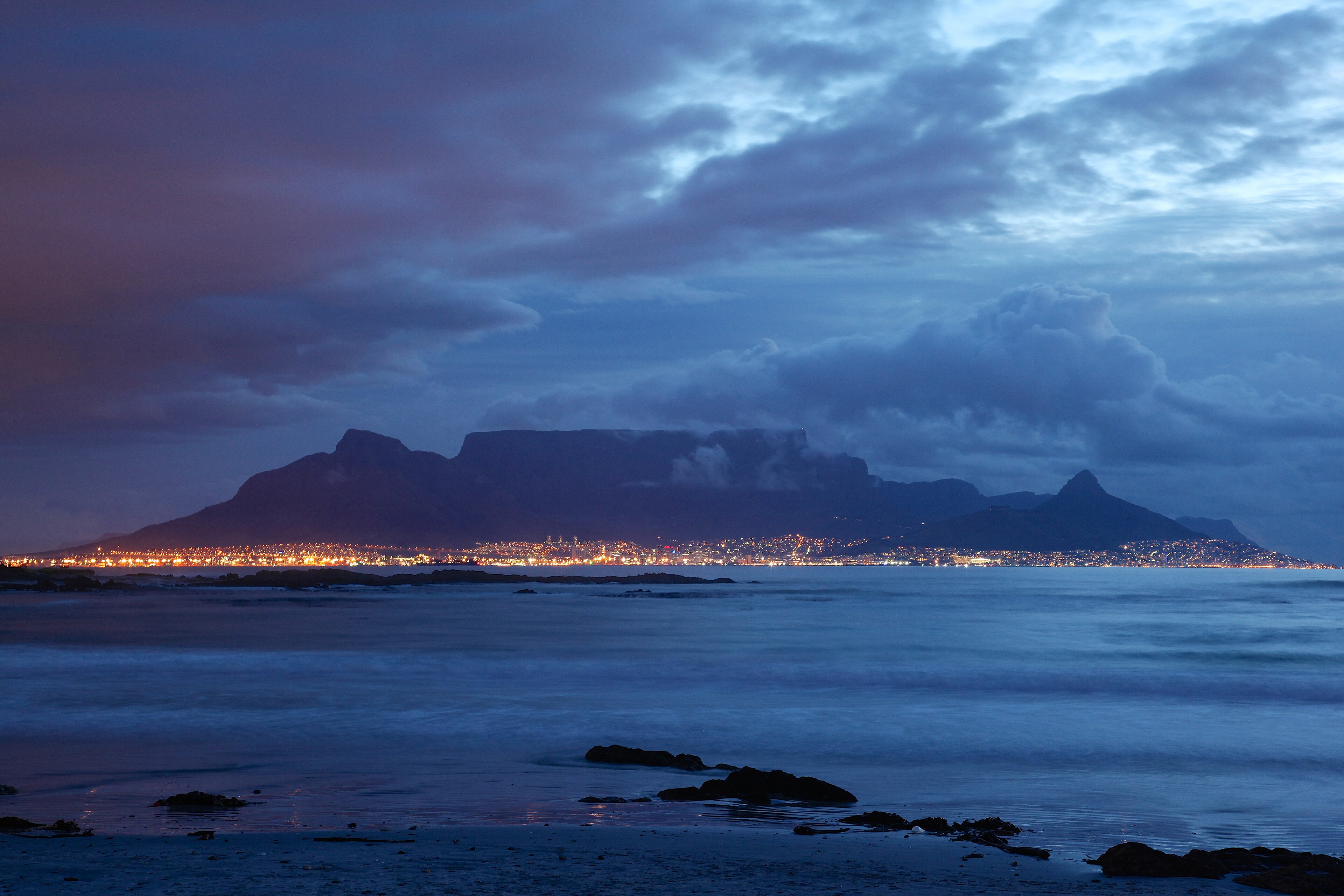 Table Mountain and Cape Town's coastline at blue hour, South Africa