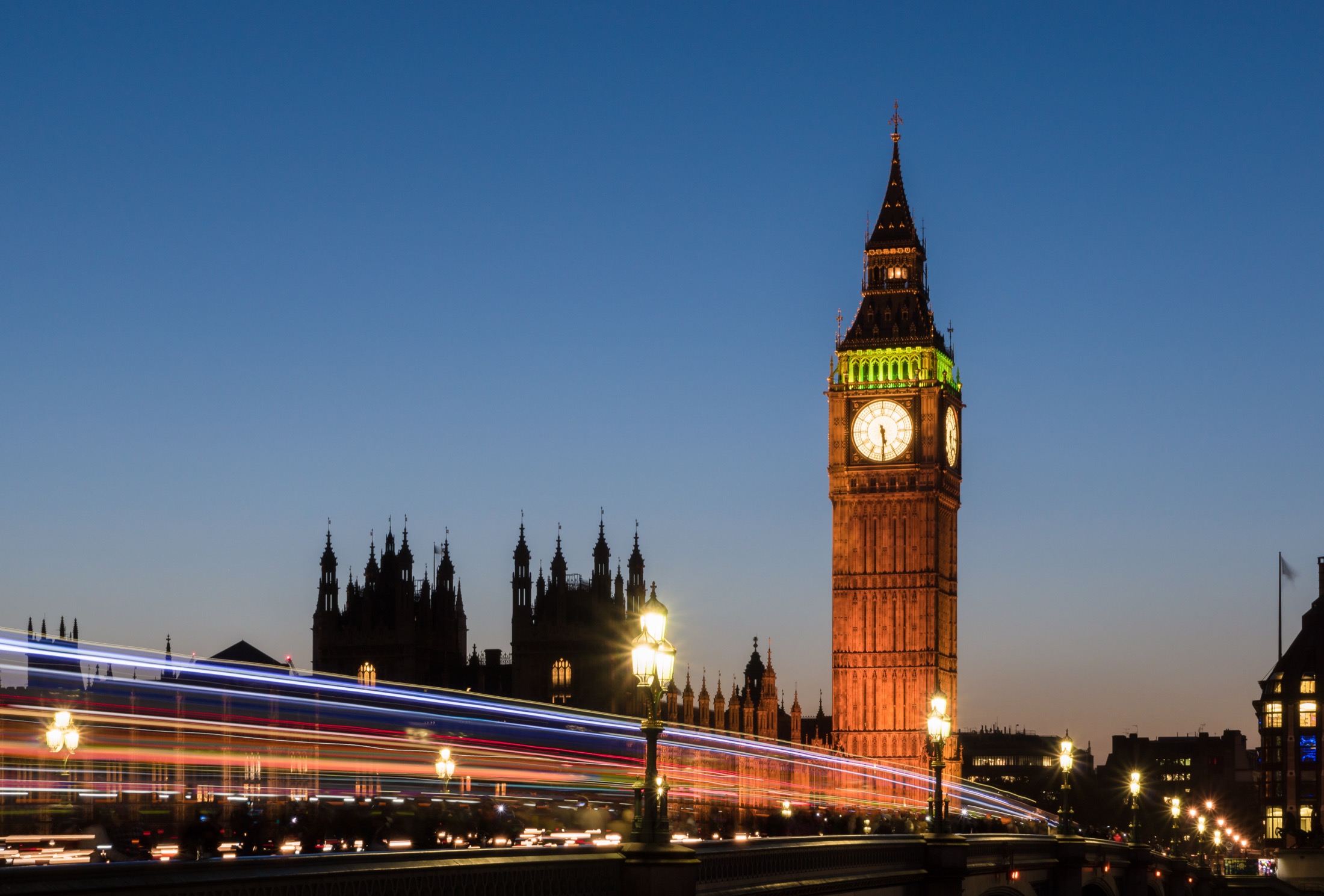 Big Ben and the Palace of Westminster at dusk seen from Westminster Bridge in London