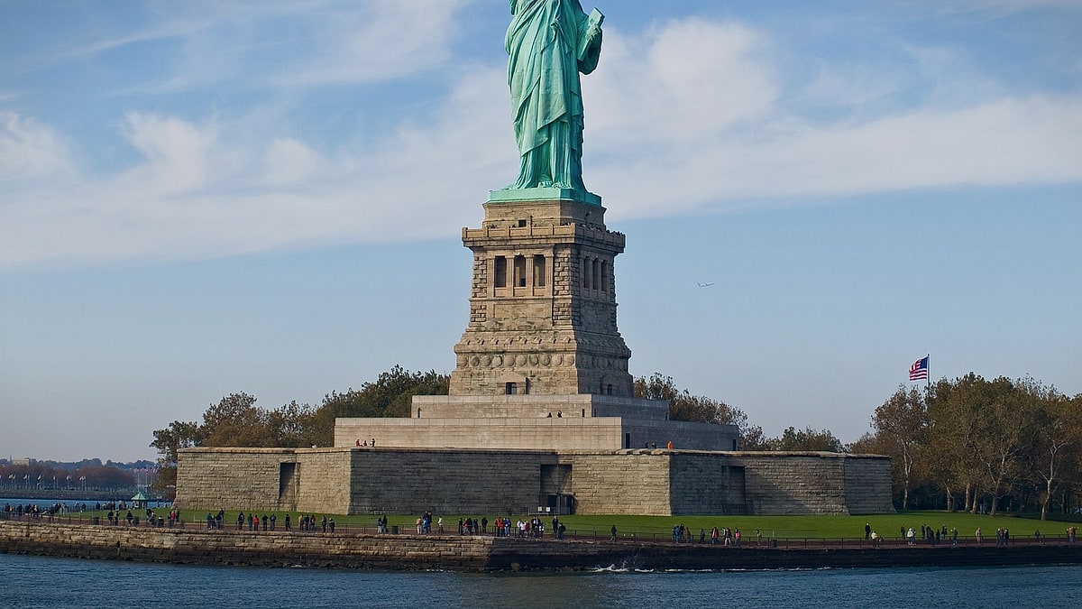 The Statue of Liberty rising above New York Harbor in the United States