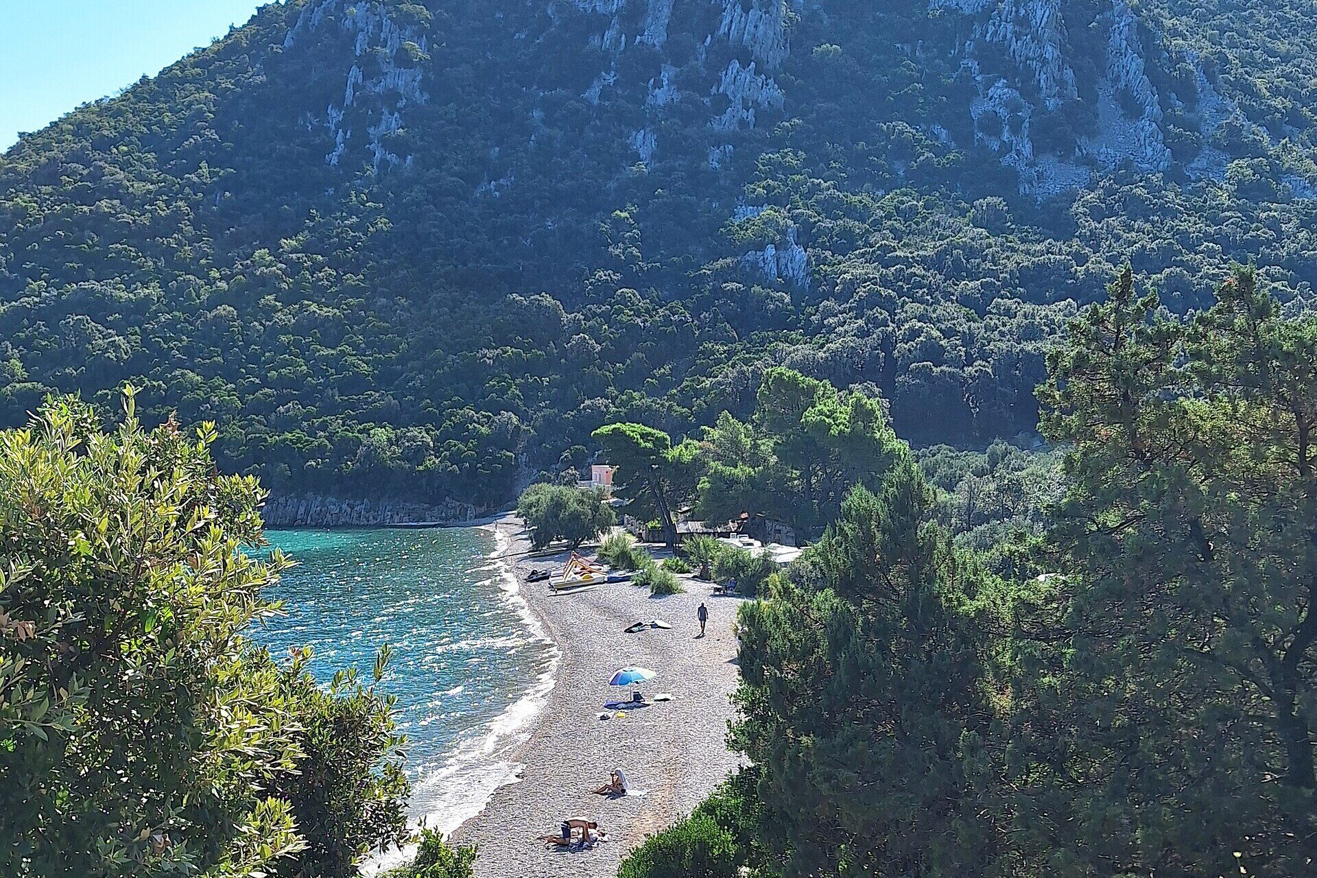 Divna Beach beneath the green slopes of the Pelješac Peninsula