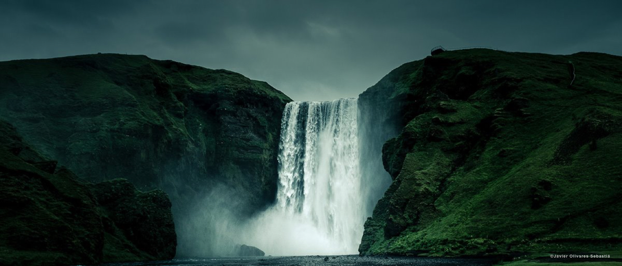 Skogafoss waterfall in Iceland under a bright summer sky