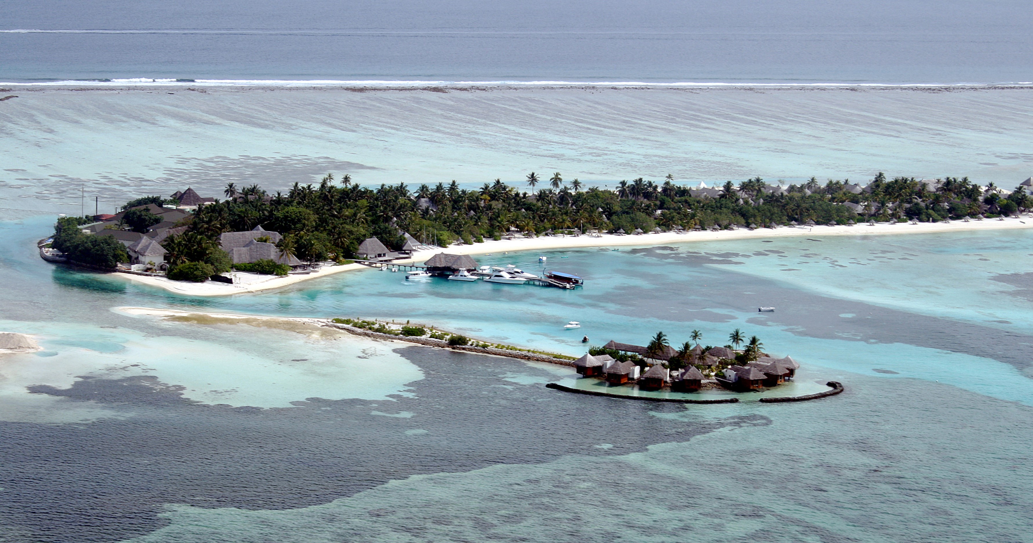 Resort island and lagoon in the Maldives seen from above