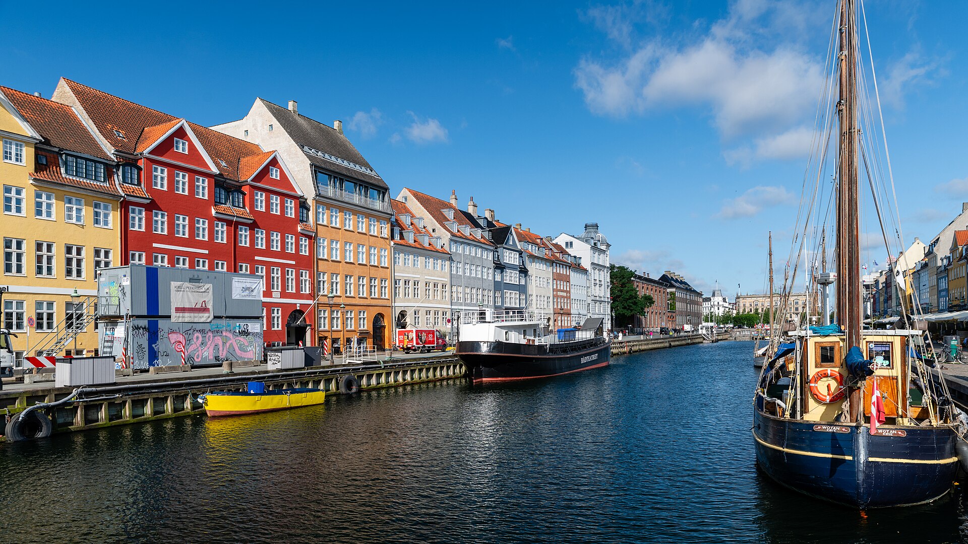 Colorful buildings and boats along Nyhavn in Copenhagen