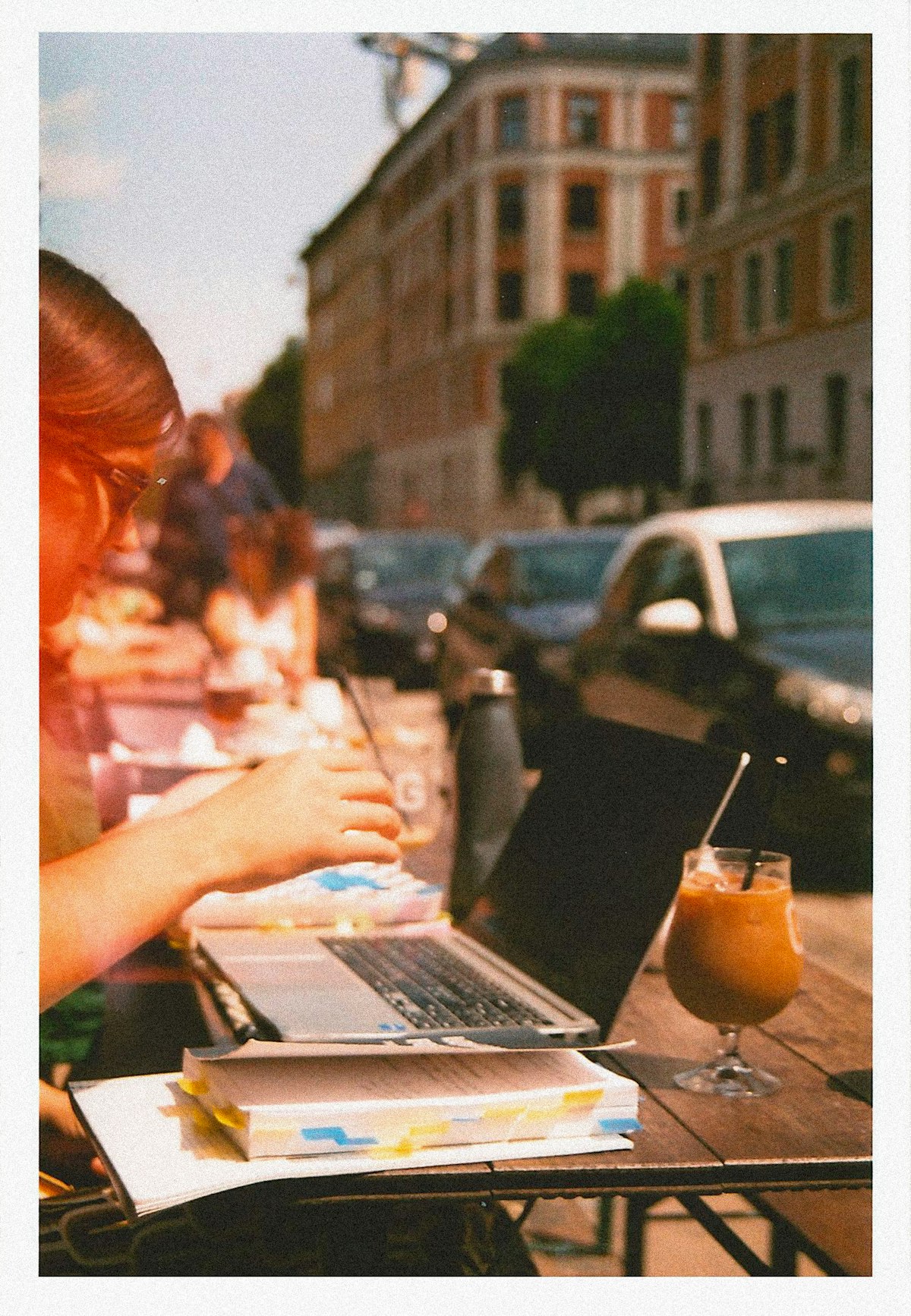 Remote worker using a laptop with a coastal backdrop