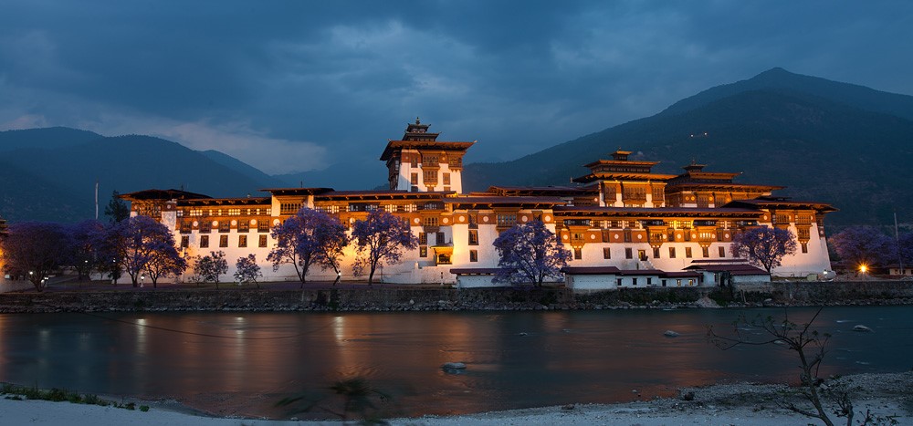 Mountain valley road and dzong landscape in Bhutan
