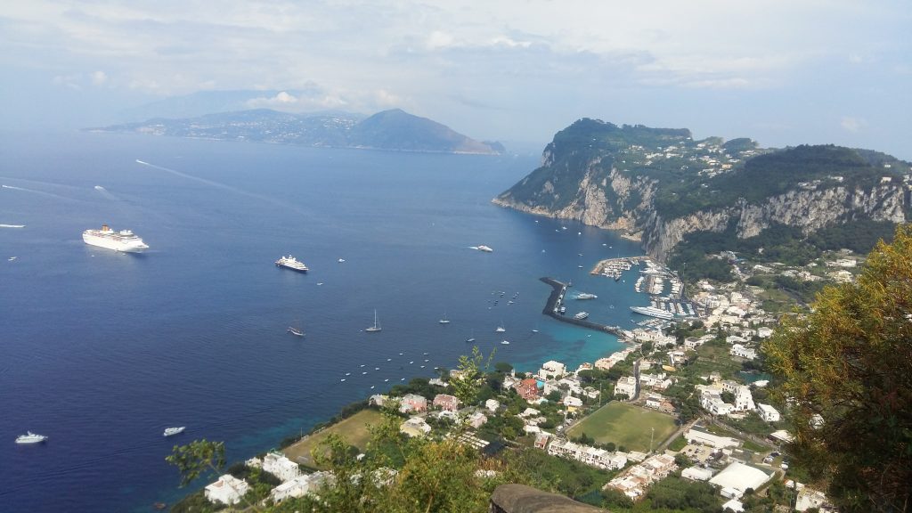 Cliffside coastline on Capri above bright blue water