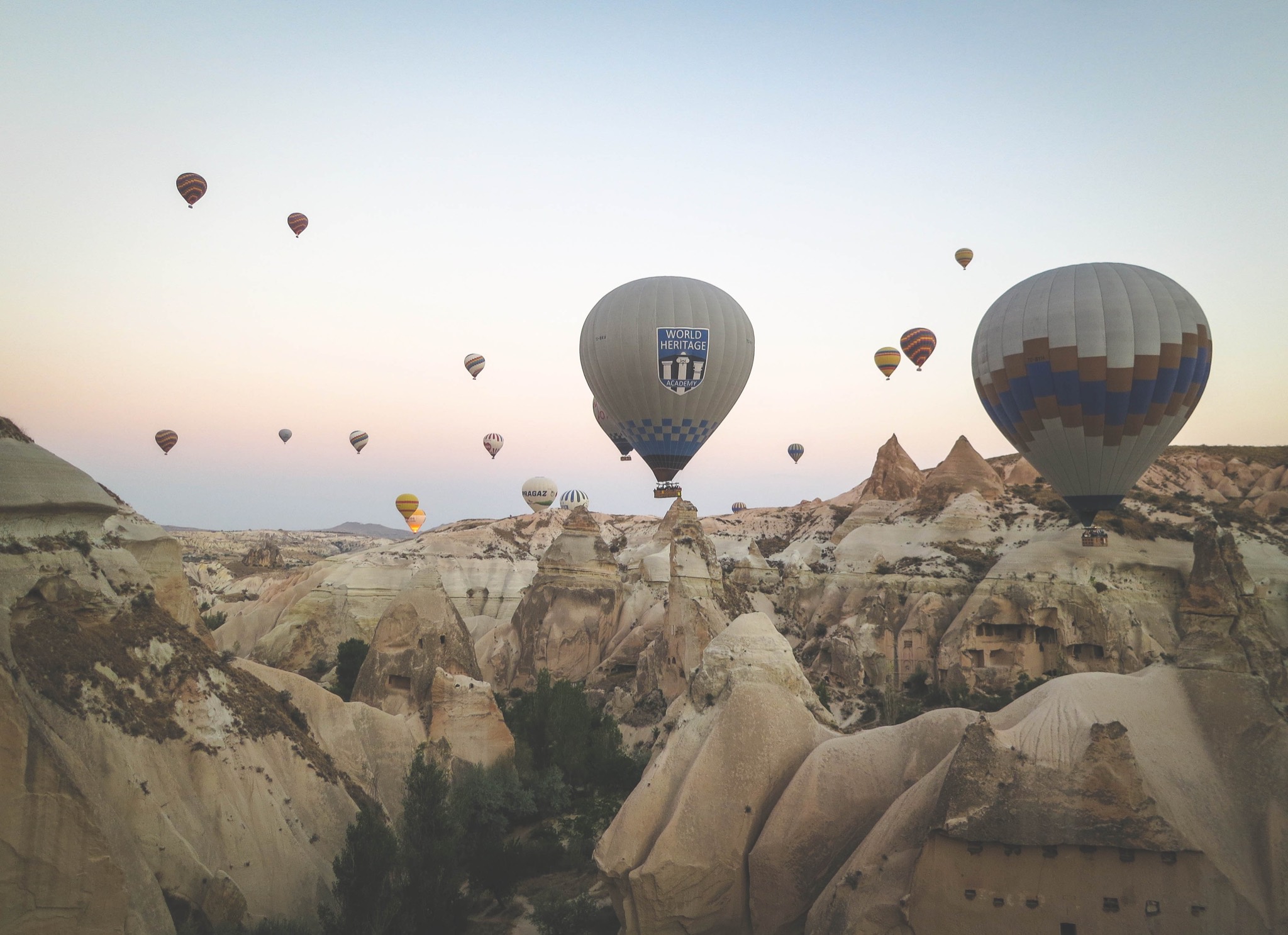 Traveler looking across an open landscape at dawn